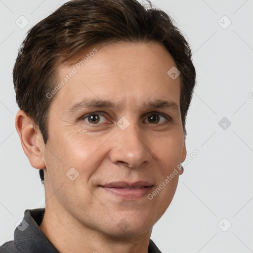 Joyful white adult male with short  brown hair and brown eyes