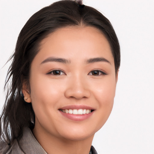 Joyful white young-adult female with long  black hair and brown eyes