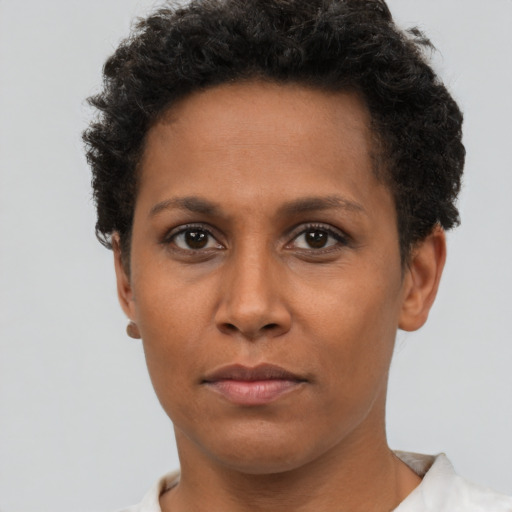Neutral black adult female with short  brown hair and brown eyes