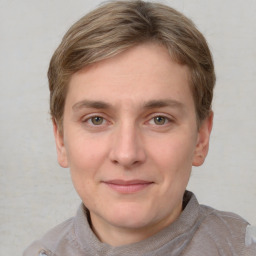 Joyful white adult male with short  brown hair and grey eyes