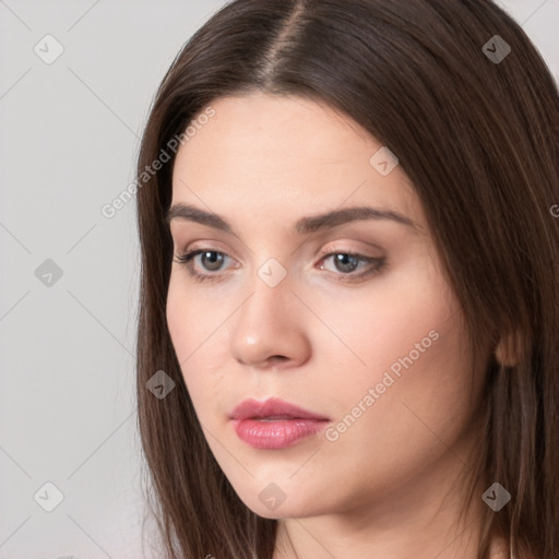 Neutral white young-adult female with long  brown hair and brown eyes