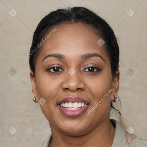 Joyful black young-adult female with short  black hair and brown eyes