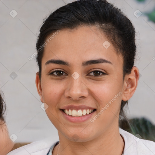 Joyful white young-adult female with short  brown hair and brown eyes