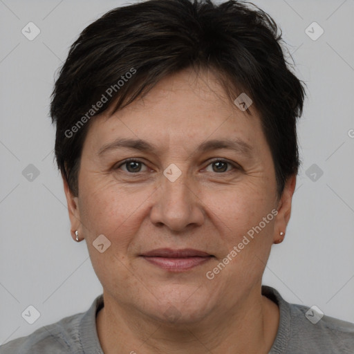 Joyful white adult female with short  brown hair and brown eyes