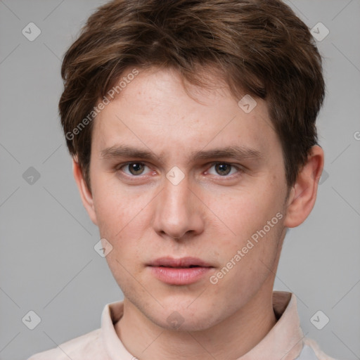 Neutral white young-adult male with short  brown hair and grey eyes