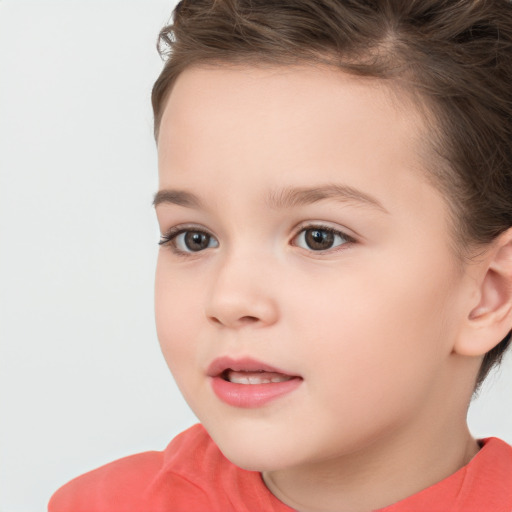 Joyful white child female with short  brown hair and brown eyes