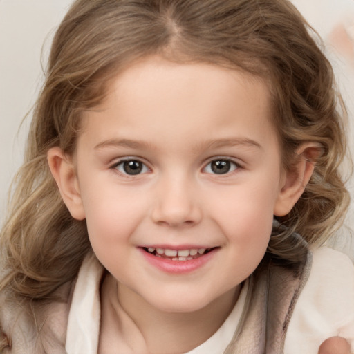 Joyful white child female with medium  brown hair and brown eyes