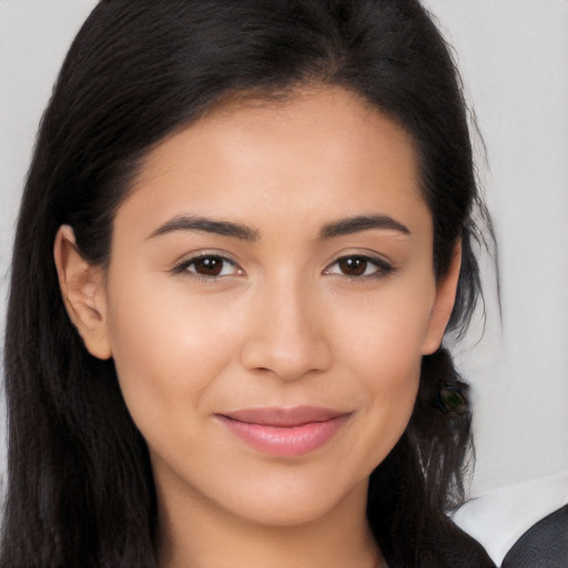 Joyful latino young-adult female with long  brown hair and brown eyes