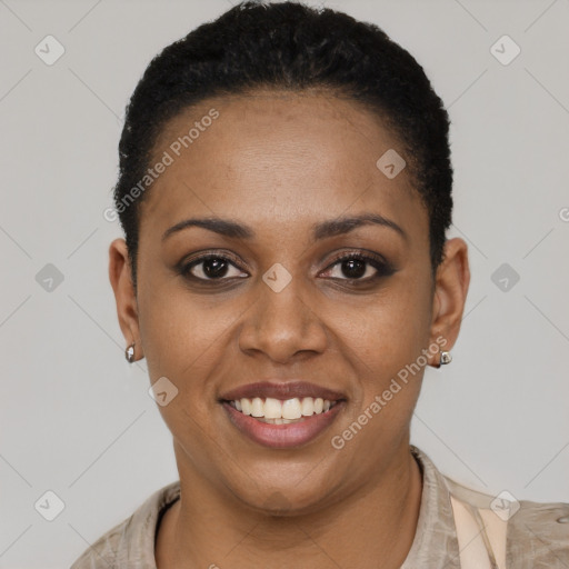 Joyful black young-adult female with short  black hair and brown eyes