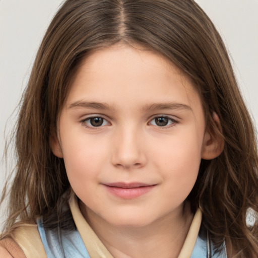 Joyful white child female with long  brown hair and brown eyes