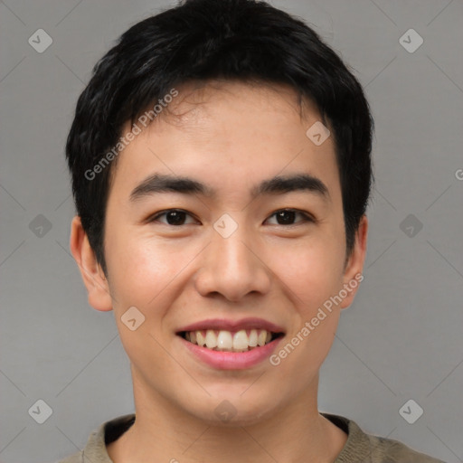 Joyful asian young-adult male with short  brown hair and brown eyes