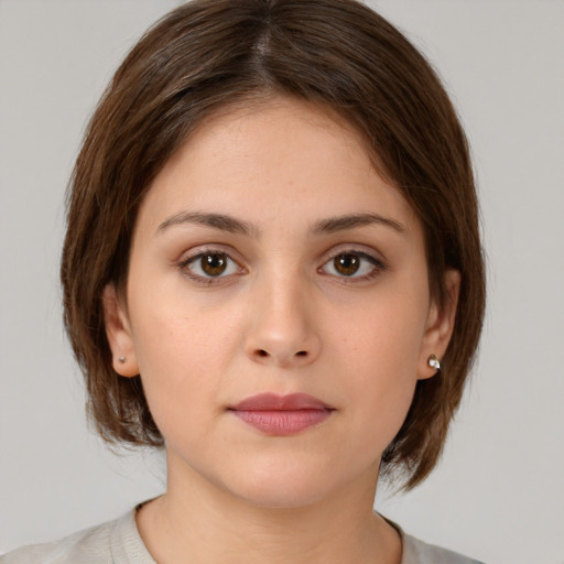 Neutral white young-adult female with medium  brown hair and brown eyes