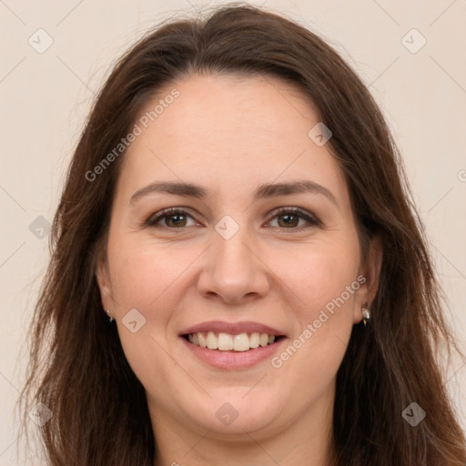 Joyful white young-adult female with long  brown hair and brown eyes