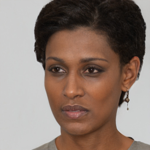 Neutral black young-adult female with short  brown hair and brown eyes