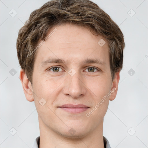 Joyful white adult male with short  brown hair and grey eyes