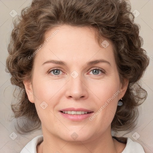 Joyful white young-adult female with medium  brown hair and blue eyes