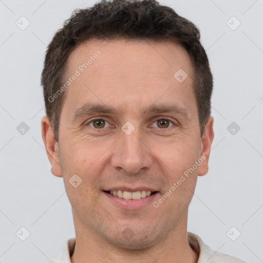 Joyful white adult male with short  brown hair and brown eyes