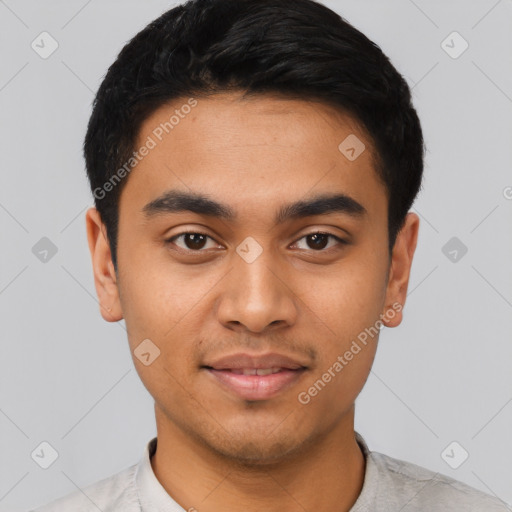 Joyful latino young-adult male with short  black hair and brown eyes