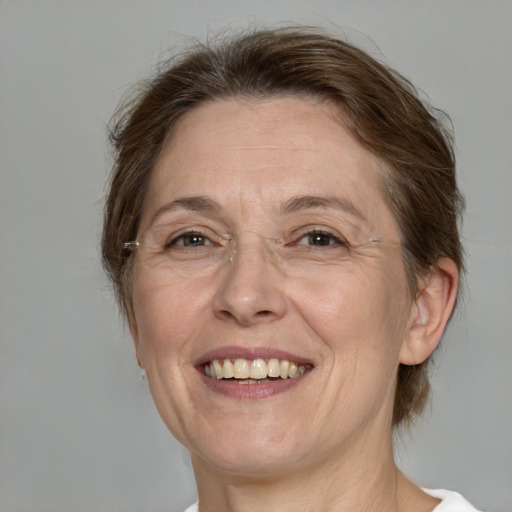 Joyful white middle-aged female with medium  brown hair and brown eyes