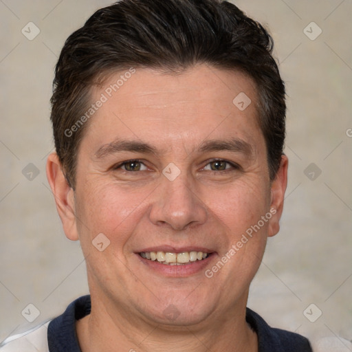 Joyful white adult male with short  brown hair and brown eyes