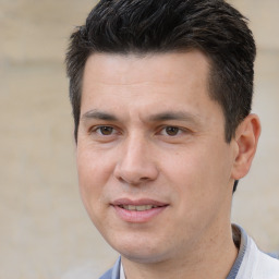 Joyful white adult male with short  brown hair and brown eyes