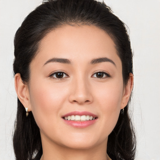 Joyful white young-adult female with long  brown hair and brown eyes