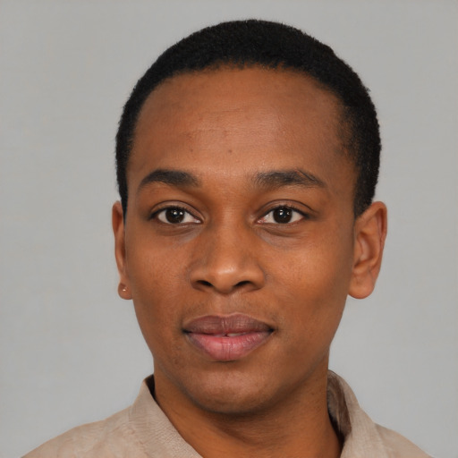 Joyful black young-adult male with short  black hair and brown eyes