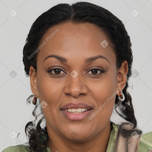 Joyful black adult female with medium  brown hair and brown eyes