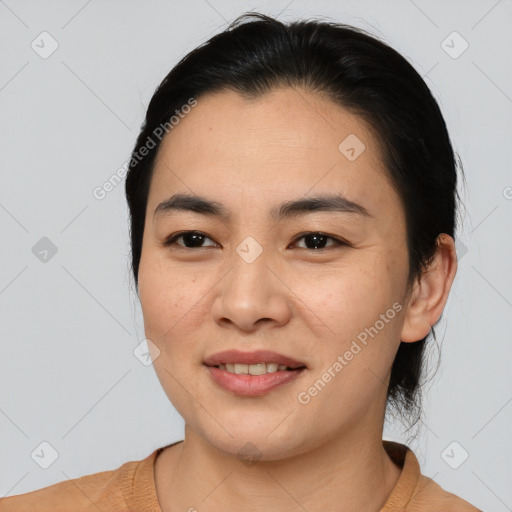 Joyful asian young-adult female with medium  black hair and brown eyes