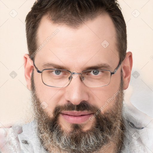 Joyful white adult male with short  brown hair and grey eyes