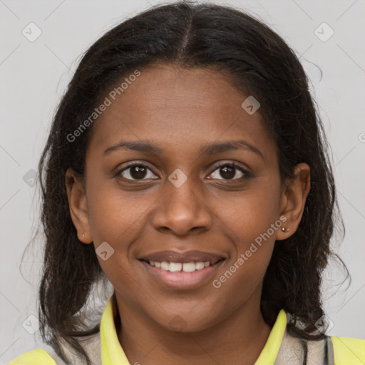 Joyful black young-adult female with medium  brown hair and brown eyes