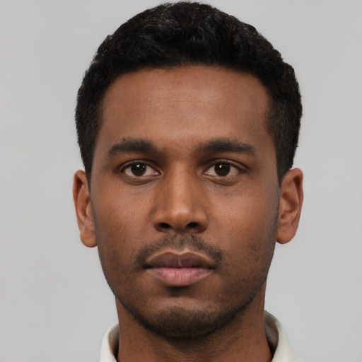 Neutral latino young-adult male with short  black hair and brown eyes
