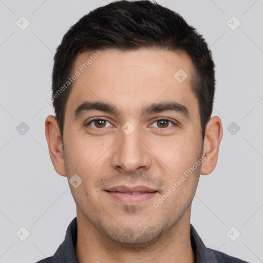 Joyful white young-adult male with short  black hair and brown eyes