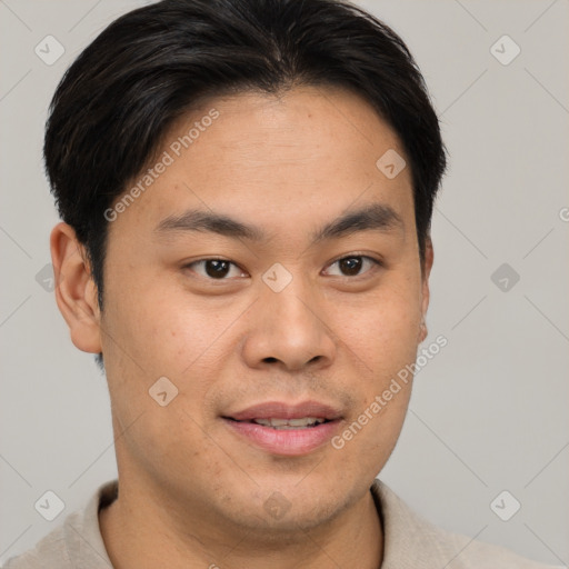 Joyful asian young-adult male with short  brown hair and brown eyes