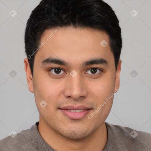 Joyful latino young-adult male with short  brown hair and brown eyes