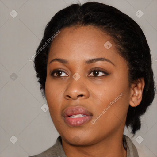 Joyful black young-adult female with medium  black hair and brown eyes