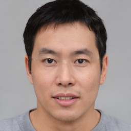 Neutral asian young-adult male with short  brown hair and brown eyes