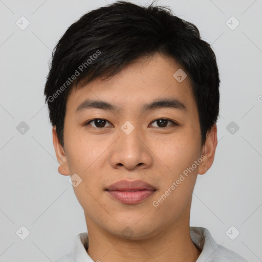 Joyful asian young-adult male with short  black hair and brown eyes