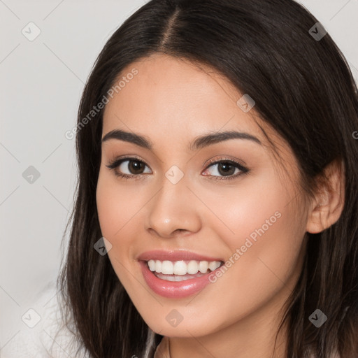 Joyful white young-adult female with long  brown hair and brown eyes