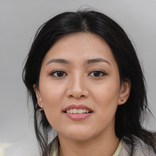 Joyful asian young-adult female with medium  black hair and brown eyes