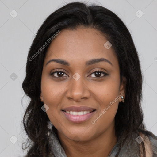 Joyful black young-adult female with long  brown hair and brown eyes