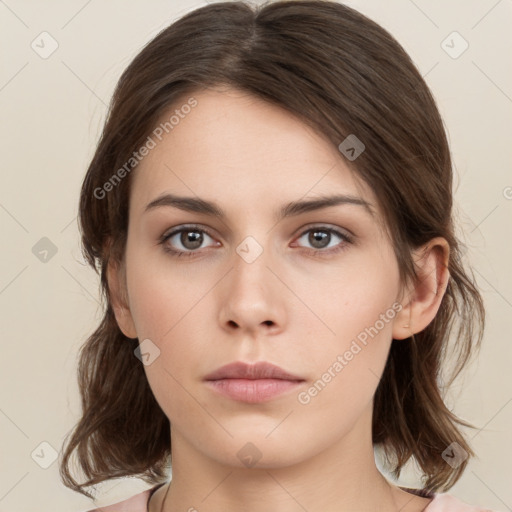 Neutral white young-adult female with medium  brown hair and brown eyes