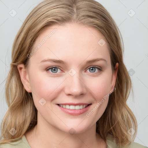 Joyful white young-adult female with medium  brown hair and blue eyes