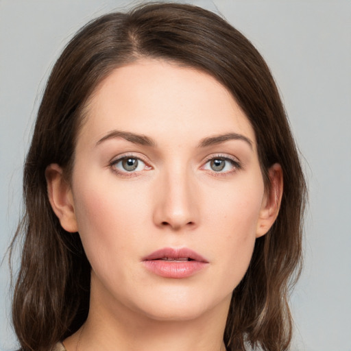 Neutral white young-adult female with long  brown hair and grey eyes