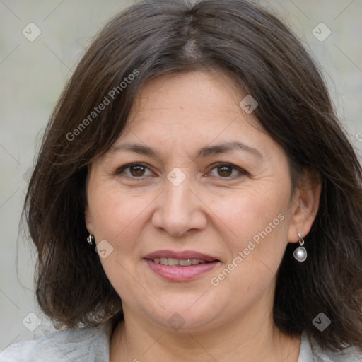 Joyful white adult female with medium  brown hair and grey eyes