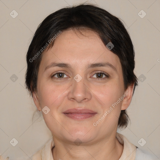 Joyful white adult female with medium  brown hair and brown eyes