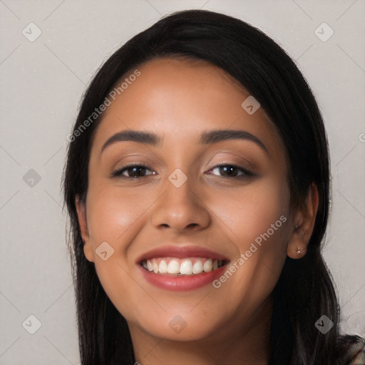 Joyful latino young-adult female with long  black hair and brown eyes