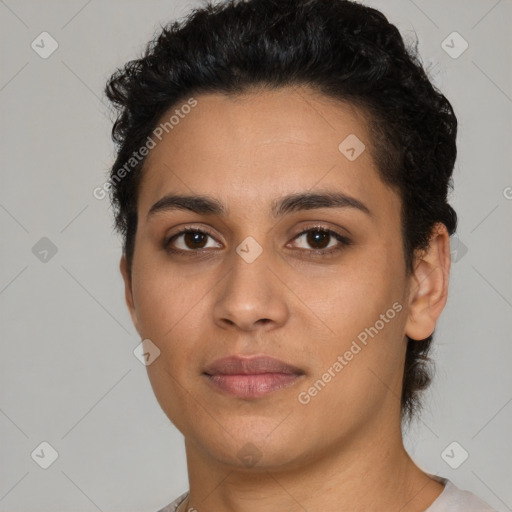 Joyful latino young-adult female with short  black hair and brown eyes