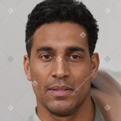 Neutral latino young-adult male with short  brown hair and brown eyes