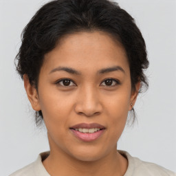 Joyful asian young-adult female with short  brown hair and brown eyes